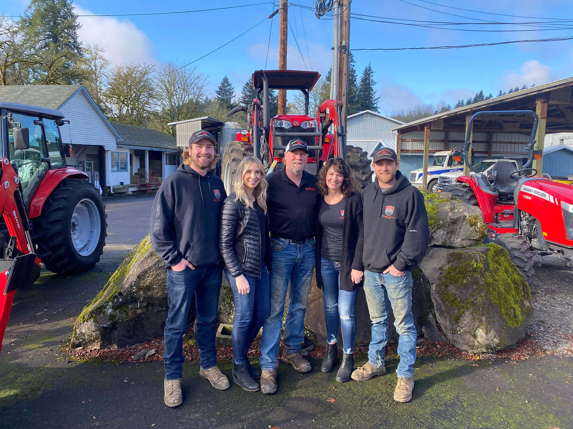 family in front of tractor