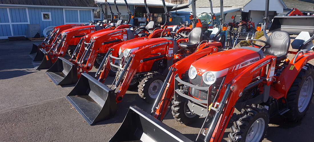 Fischer Mill red small hp tractors lined up